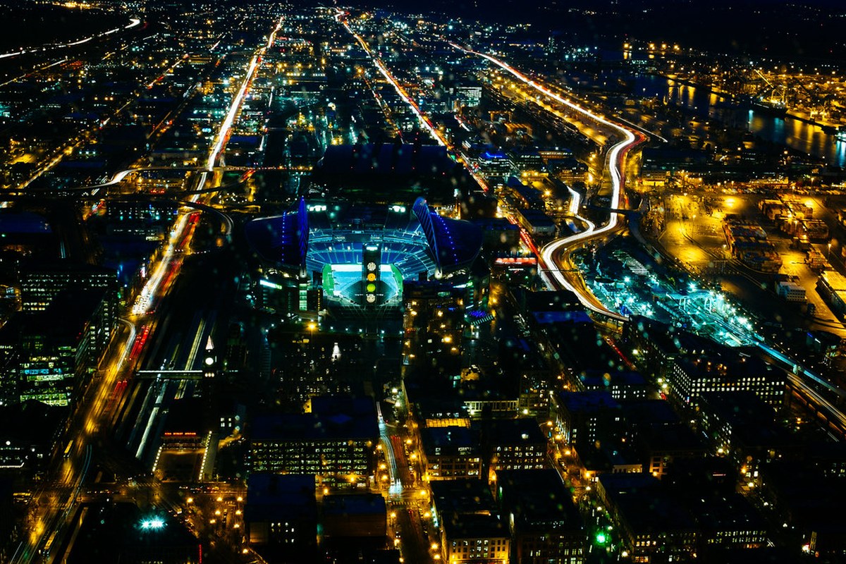 Aerial night view of Seattle's football stadium and surrounding city streets