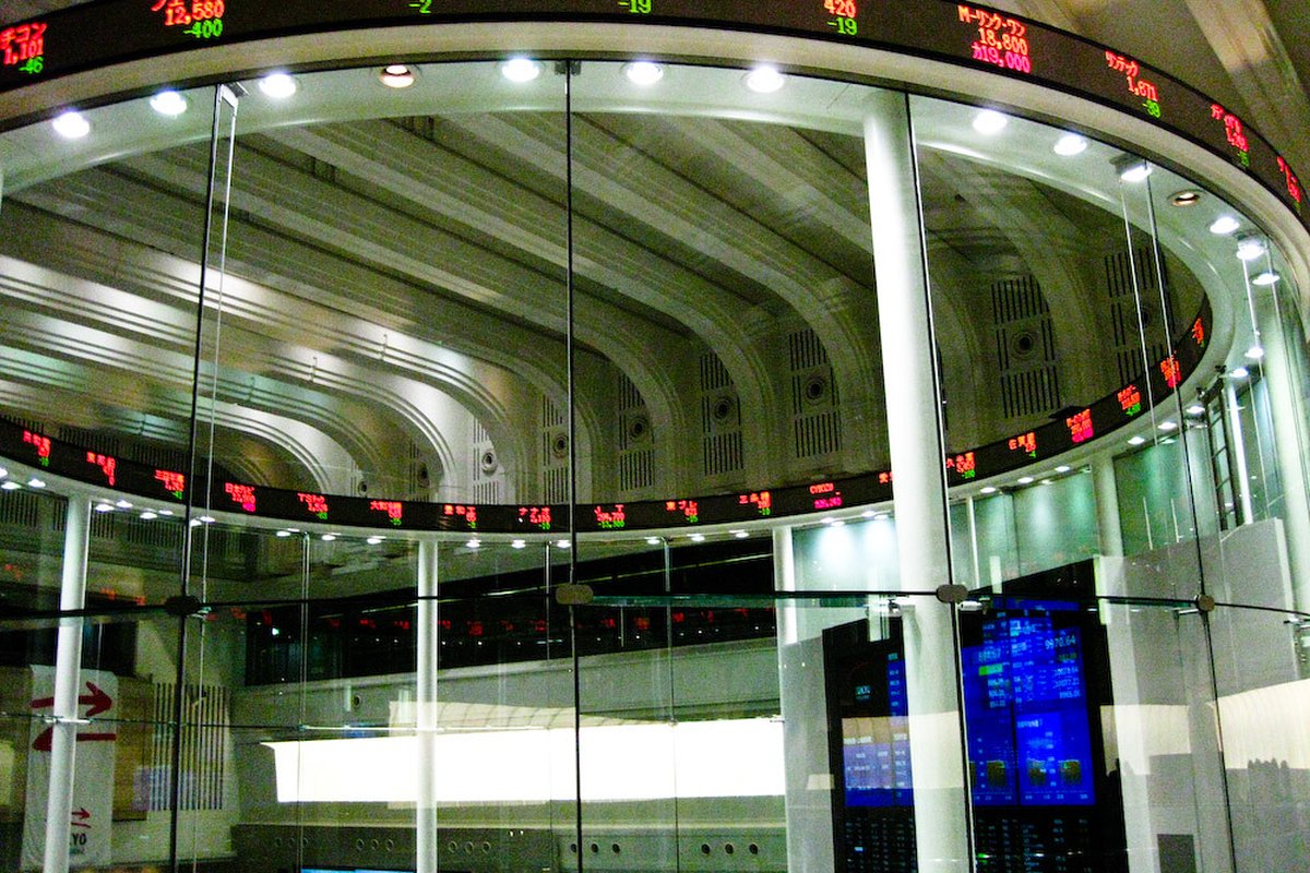 Kalshi Tax Treatment vs Stock Options, Sports Betting, and Futures Trading - stock market trading floor screens (photo 2)