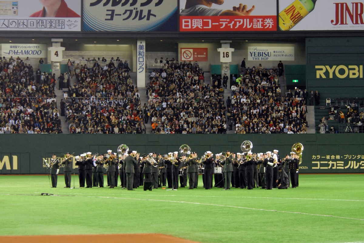 U.S. military bands perform before a 2008 MLB Opening Day game at Tokyo Dome; historical context, not the 2027 schedule