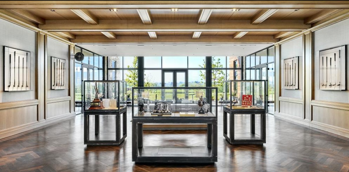 Historic golf-club and trophy displays inside Fields Ranch clubhouse, photographed January 23, 2024; not the East course or the 2027 tournament