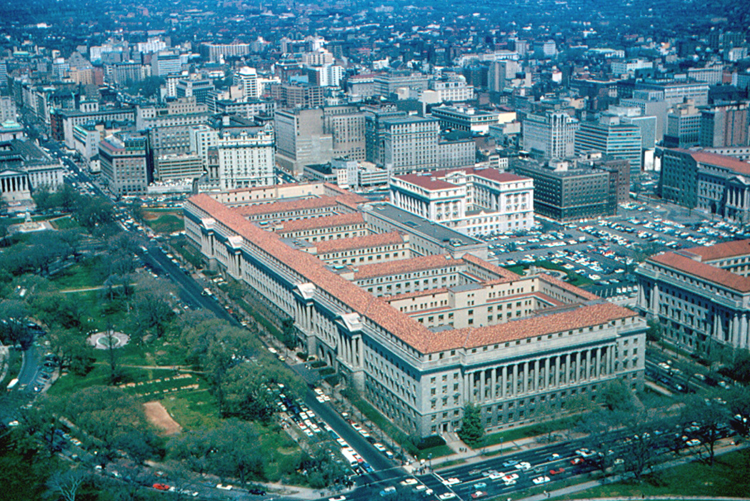 Aerial view of the U.S. Department of Commerce building and downtown Washington in 1965