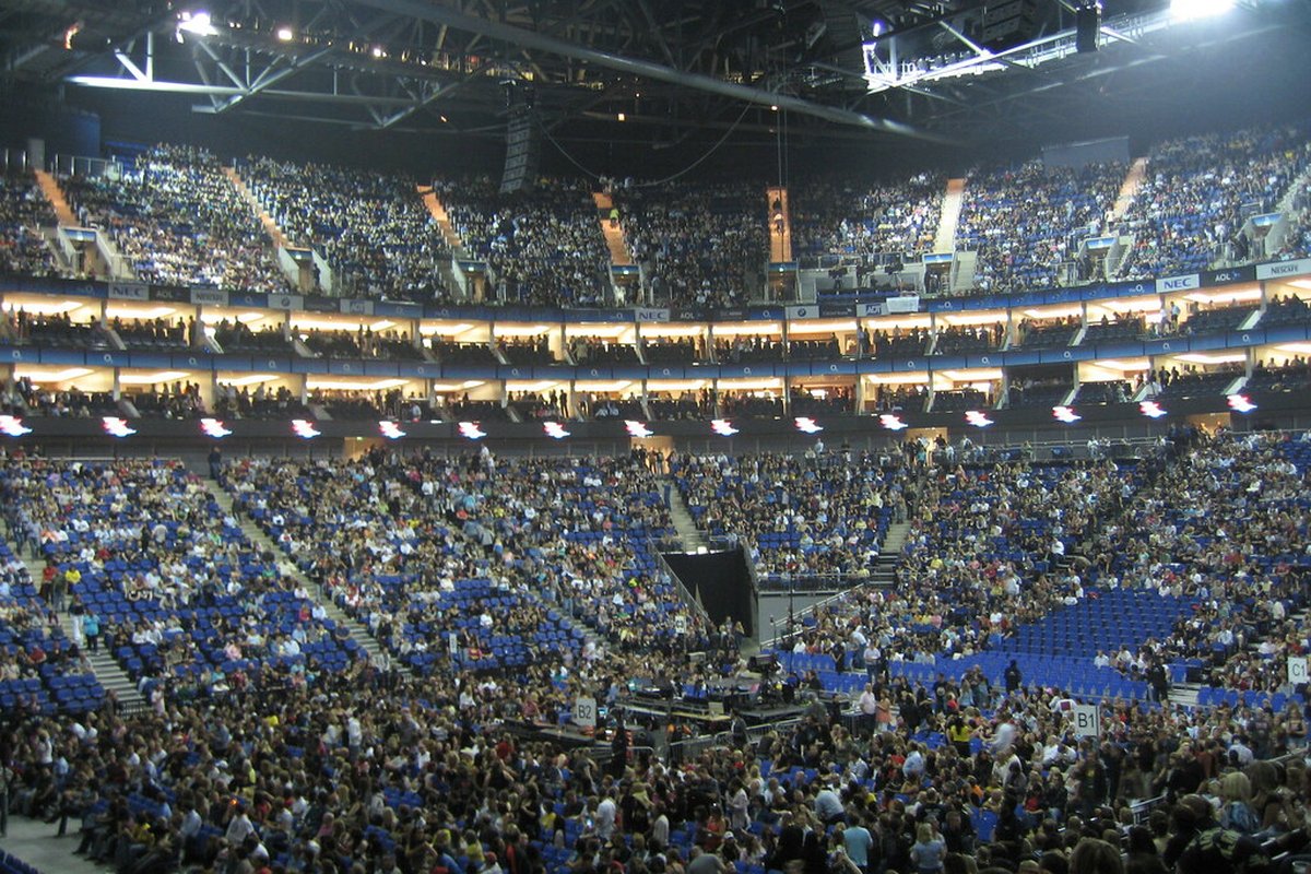 Sports on Kalshi source checklist, stadium crowd at night